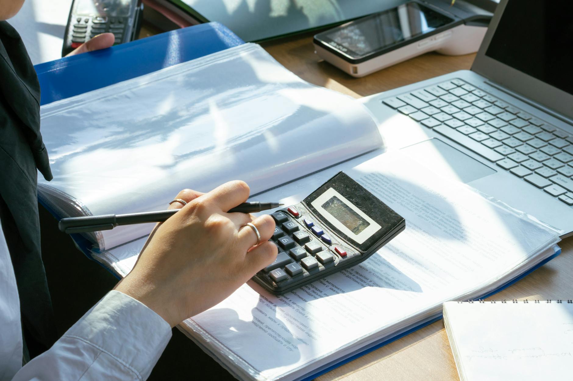 a person using a calculator