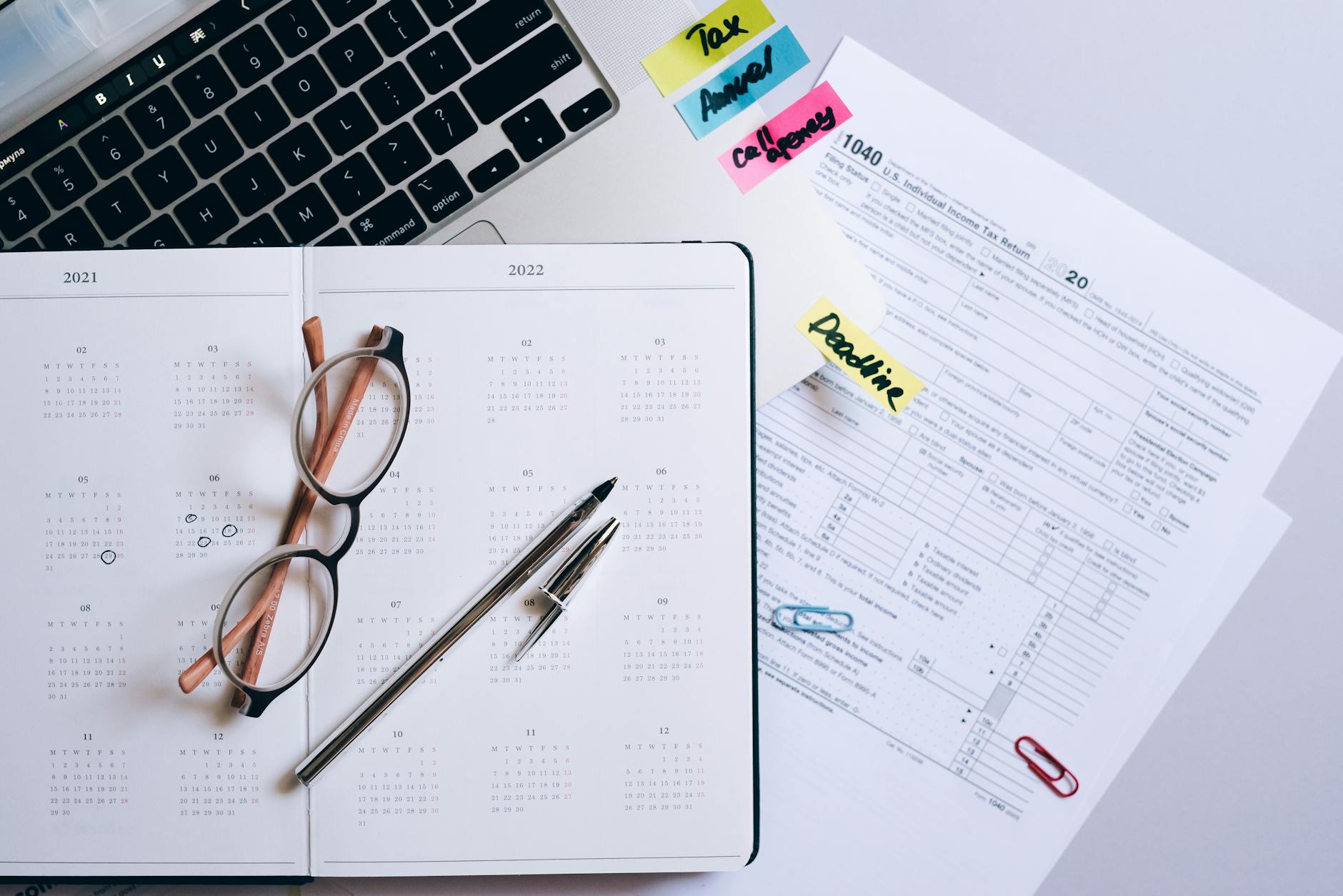 an open planner on a laptop