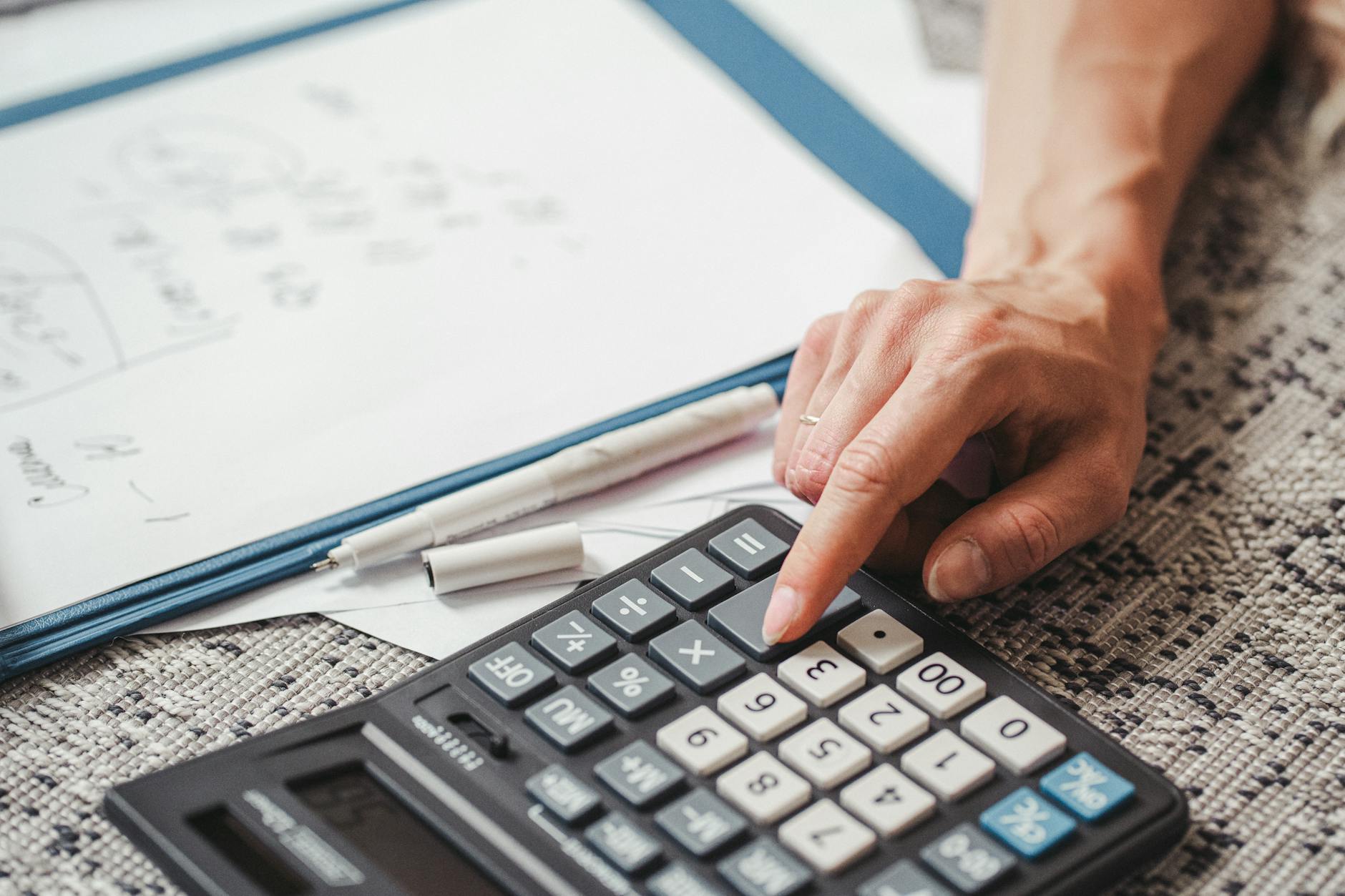 a person using a calculator